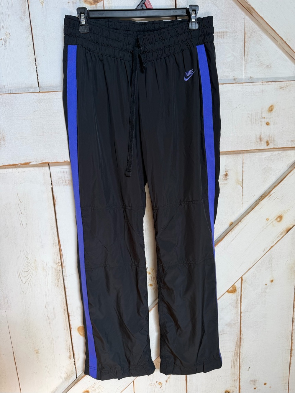 Nike women’s Black Joggers with purple Side Stripes